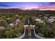 Aerial view of The Fountains community entrance and landscaped streets with mountain views at 2268 Buckingham Ct, Henderson, NV 89074