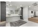 Bright bathroom featuring double sinks, a grey rug, and an open door to the shower at 2268 Buckingham Ct, Henderson, NV 89074