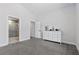 Clean bedroom with carpeted floors, white furniture and a tiled walk-in shower at 2268 Buckingham Ct, Henderson, NV 89074