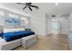 Bright primary bedroom featuring an ensuite bathroom, wooden floors, and modern decor at 2268 Buckingham Ct, Henderson, NV 89074