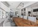 Elegant dining room with large table, hardwood floors and sliding glass doors to the backyard at 2268 Buckingham Ct, Henderson, NV 89074