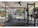 Home gym with weight rack, mirror, and glass door to the pool area at 2268 Buckingham Ct, Henderson, NV 89074