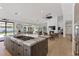 Gourmet kitchen with a large island cooktop, a fireplace, and an open floor plan at 2268 Buckingham Ct, Henderson, NV 89074