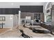 Kitchen island with a white waterfall countertop and stainless steel appliances in a modern kitchen at 2268 Buckingham Ct, Henderson, NV 89074