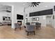 Expansive living room featuring hardwood floors, fireplace, and view of kitchen and dining room at 2268 Buckingham Ct, Henderson, NV 89074