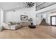 Inviting living room featuring high ceilings, hardwood floors and staircase leading to a second floor at 2268 Buckingham Ct, Henderson, NV 89074