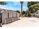 Spacious backyard featuring a shed, mature trees, and a concrete patio perfect for outdoor entertaining at 25 Colbath St, Las Vegas, NV 89110