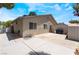 Wide backyard showcasing a concrete patio, grill, and storage shed providing ample outdoor living space at 25 Colbath St, Las Vegas, NV 89110