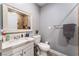 Bathroom vanity with a framed mirror, a white countertop, and a view to the toilet at 25 Colbath St, Las Vegas, NV 89110