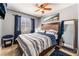 Bedroom featuring a wooden-framed bed, a ceiling fan, and a view to the window at 25 Colbath St, Las Vegas, NV 89110