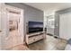 Spacious bedroom with private bathroom entrance, television and plenty of storage at 25 Colbath St, Las Vegas, NV 89110