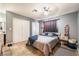 Comfortable bedroom featuring double closets, updated colors, and modern ceiling fan at 25 Colbath St, Las Vegas, NV 89110