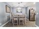 Light-filled dining area showcasing tile flooring, modern decor, and stainless steel refrigerator at 25 Colbath St, Las Vegas, NV 89110