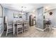 Bright dining area with a modern chandelier, stylish decor, and view into kitchen at 25 Colbath St, Las Vegas, NV 89110