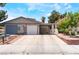Home showing a long driveway, two-car garage, and covered carport for convenient parking at 25 Colbath St, Las Vegas, NV 89110