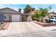Charming home featuring a wide driveway, covered carport, and well-manicured landscaping at 25 Colbath St, Las Vegas, NV 89110