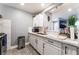 Well-lit kitchen featuring white cabinets, stainless steel appliances, and granite countertops at 25 Colbath St, Las Vegas, NV 89110