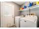 Laundry room featuring a side-by-side washer and dryer and a door to the outside at 25 Colbath St, Las Vegas, NV 89110