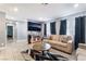 Cozy living area with a mounted television and easy access to other parts of the house at 25 Colbath St, Las Vegas, NV 89110