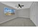 Bright bedroom with large window, spacious closet, and neutral carpeting, creating a serene and comfortable retreat at 2635 Heritage Ct, Las Vegas, NV 89121