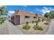 Low-rise building with desert landscaping featuring gravel and mature shrubs at 2635 Heritage Ct, Las Vegas, NV 89121