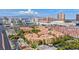 Wide aerial shot of the complex shows the property's layout and surrounding city, with a skyline view at 270 E Flamingo Rd # 223, Las Vegas, NV 89169