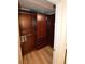 Organized walk-in closet with wood shelving and ample storage space for clothing and accessories at 270 E Flamingo Rd # 223, Las Vegas, NV 89169