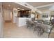 Bright dining area with seating for six and mirrors, leading to the kitchen at 270 E Flamingo Rd # 223, Las Vegas, NV 89169
