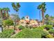 Beautiful landscaping surrounding a building showcasing palm trees, lush greenery, and architecture at 270 E Flamingo Rd # 223, Las Vegas, NV 89169