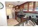 Kitchen features stainless steel appliances, dark countertops, and ample cabinet space at 270 E Flamingo Rd # 223, Las Vegas, NV 89169