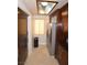 Galley kitchen featuring stainless steel appliances, ample cabinet space, and a window for natural light at 270 E Flamingo Rd # 223, Las Vegas, NV 89169