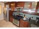 Kitchen features stainless steel appliances, dark countertops, and ample cabinet space at 270 E Flamingo Rd # 223, Las Vegas, NV 89169