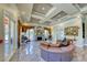 Elegant living room with marble floors, coffered ceilings, fireplace, and luxurious furnishings at 270 E Flamingo Rd # 223, Las Vegas, NV 89169