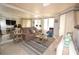 Inviting living room featuring comfortable seating, large mirrors, and natural light from windows at 270 E Flamingo Rd # 223, Las Vegas, NV 89169