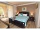 Cozy main bedroom features a comfortable king bed, stylish decor, and a private balcony at 270 E Flamingo Rd # 223, Las Vegas, NV 89169