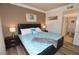 Comfortable main bedroom with wood floors, a king bed, and ensuite bathroom access at 270 E Flamingo Rd # 223, Las Vegas, NV 89169