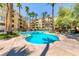 Charming community pool with lush greenery and ample seating at 270 E Flamingo Rd # 223, Las Vegas, NV 89169