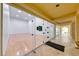 Bright racquetball court with wood floors and glass doors leading to a hall, providing an active amenity at 270 E Flamingo Rd # 223, Las Vegas, NV 89169