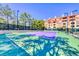 Beautifully maintained tennis court with green and purple surfaces, set against a complex building backdrop at 270 E Flamingo Rd # 223, Las Vegas, NV 89169