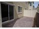 Paver stone patio with sliding glass door is perfect for grilling and entertaining guests outdoors at 2761 Frosted Teal Ave, North Las Vegas, NV 89086