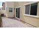 Paver stone patio with sliding glass door is perfect for grilling and entertaining guests outdoors at 2761 Frosted Teal Ave, North Las Vegas, NV 89086