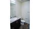 Bathroom featuring a vanity with granite countertops, a toilet, and a shower behind the door at 2761 Frosted Teal Ave, North Las Vegas, NV 89086