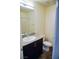 Bathroom featuring a vanity with granite countertops, a toilet, and a shower behind the door at 2761 Frosted Teal Ave, North Las Vegas, NV 89086