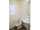 Powder room featuring a pedestal sink, wood-look flooring, and neutral decor at 2761 Frosted Teal Ave, North Las Vegas, NV 89086