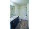 Modern bathroom featuring dual sinks with granite countertops and a tub-shower combo at 2761 Frosted Teal Ave, North Las Vegas, NV 89086
