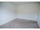 Neutral bedroom featuring carpet flooring, baseboards, and a door at 2761 Frosted Teal Ave, North Las Vegas, NV 89086