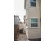 View of the exterior side of the home with air conditioning unit and view of neighboring houses at 2761 Frosted Teal Ave, North Las Vegas, NV 89086