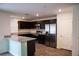 Well-equipped kitchen with stainless steel appliances, dark cabinets, and granite countertops at 2761 Frosted Teal Ave, North Las Vegas, NV 89086