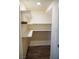 Walk-in pantry featuring vinyl floor and white shelving at 2761 Frosted Teal Ave, North Las Vegas, NV 89086