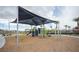 Community playground with shade structure, providing a fun and safe environment for children to play at 2761 Frosted Teal Ave, North Las Vegas, NV 89086